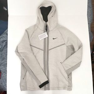 NIKE
Grey Tech Pack Windrunner Jacket. Brand New.